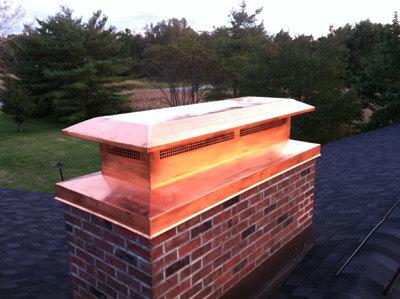 Before and after chimney cap replacement in East Hampton, NY