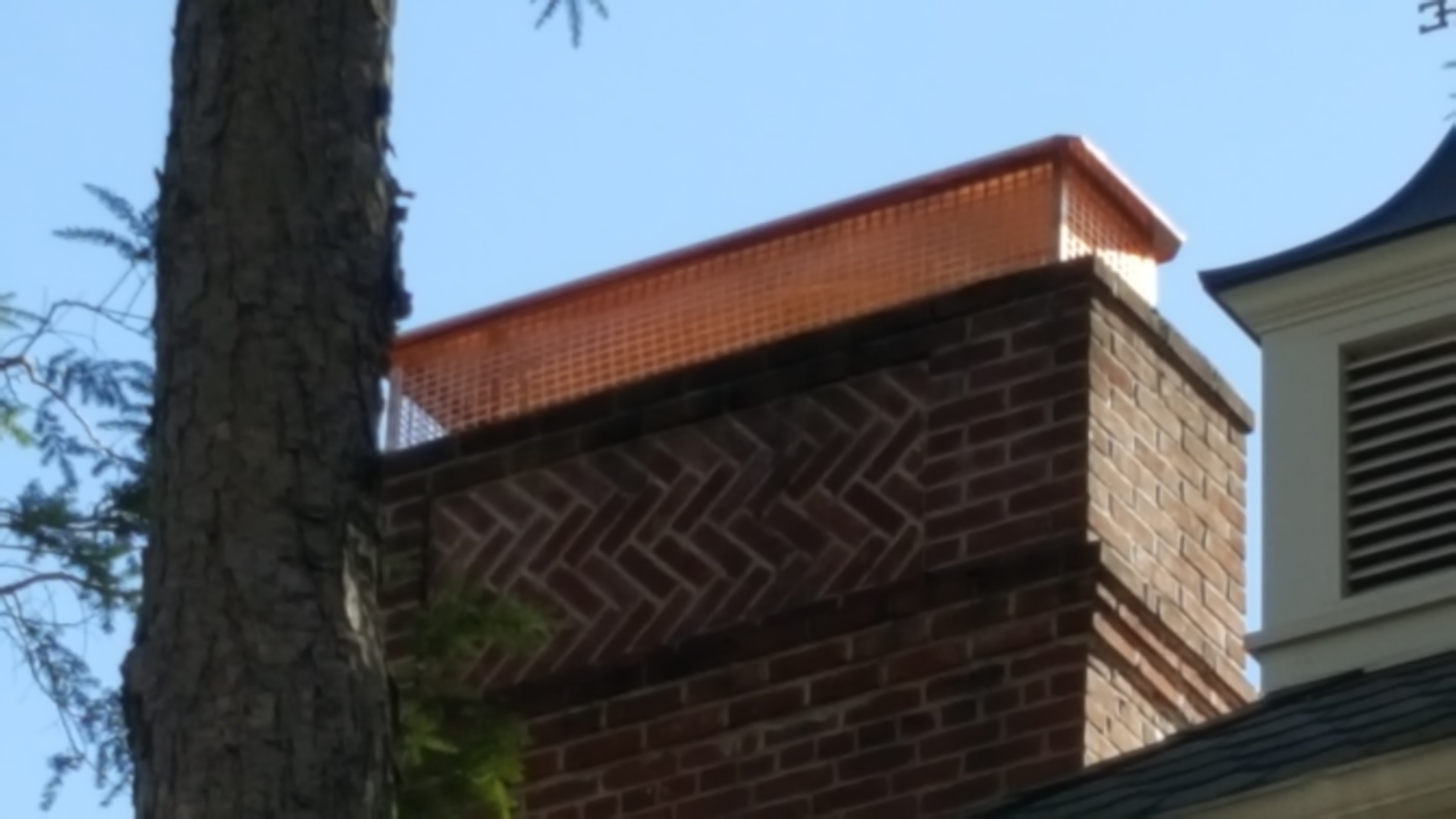 New stainless steel chimney cap installed in East Hampton, NY