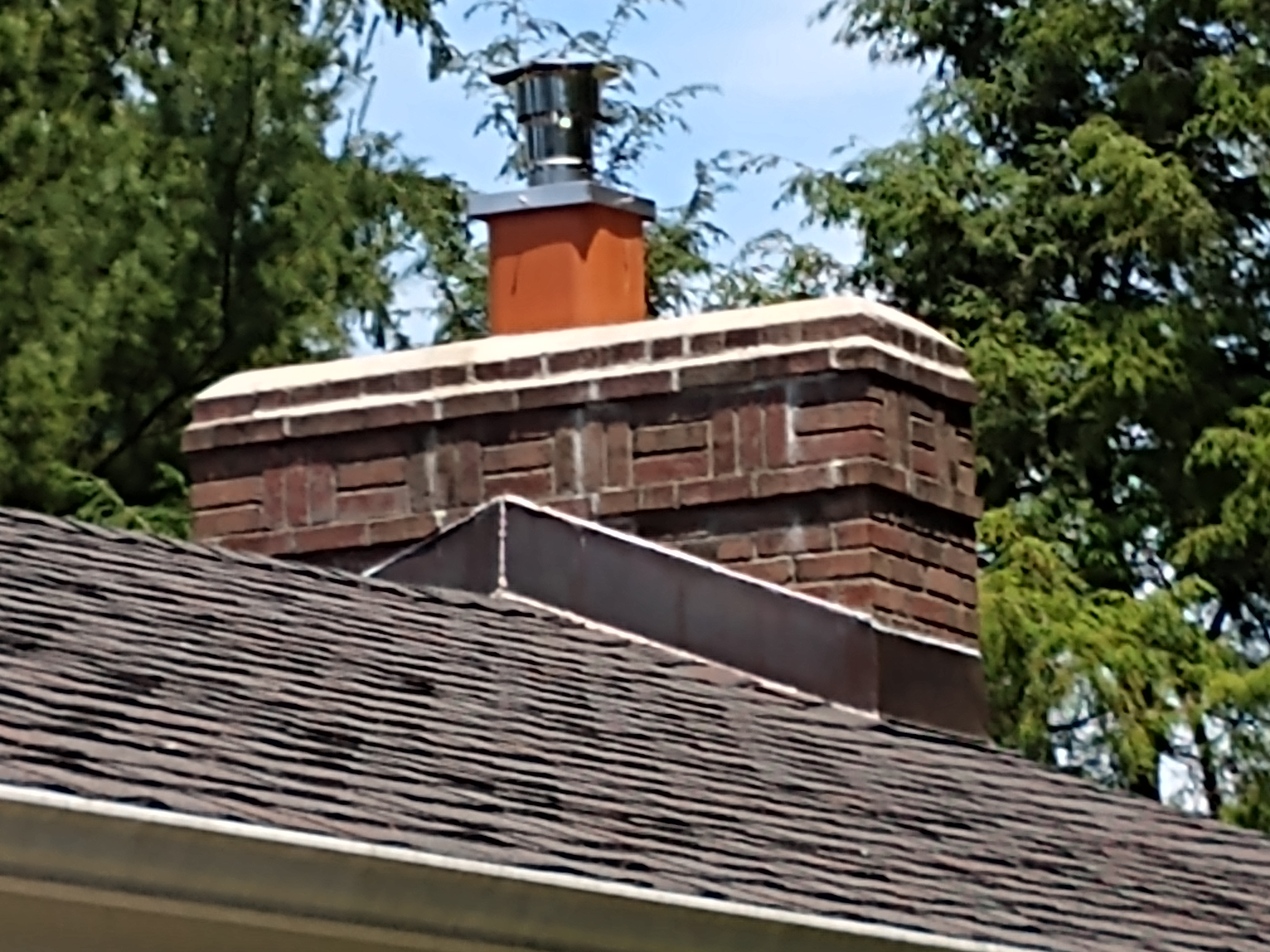 Stainless steel chimney cap with animal guard in East Hampton, New York